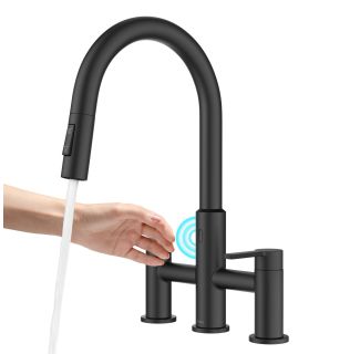 Matte Black Touchless Sensor Bridge Kitchen Faucet with a Touch-Activated Sensor. A Woman hand is shown hovering over the sensor, activating the flow of water.
